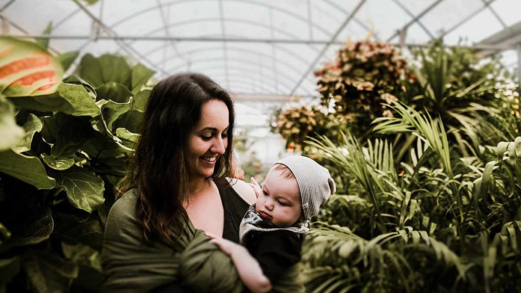 a woman holding a baby