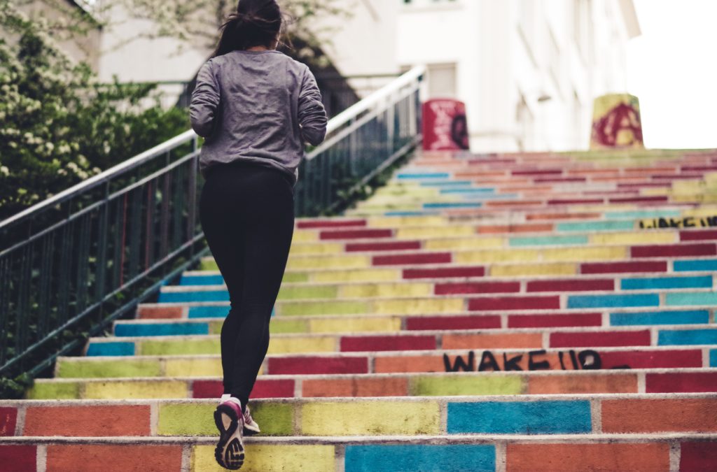 a woman running up stairs