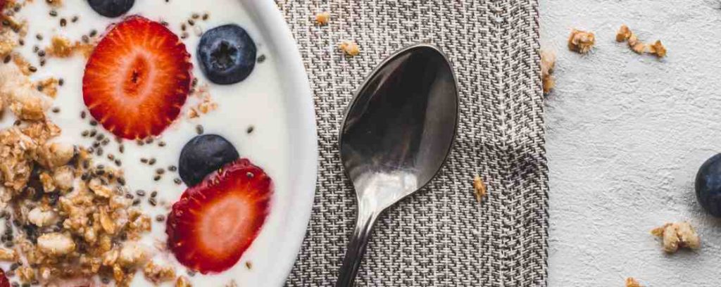 stainless steel spoon on white ceramic plate